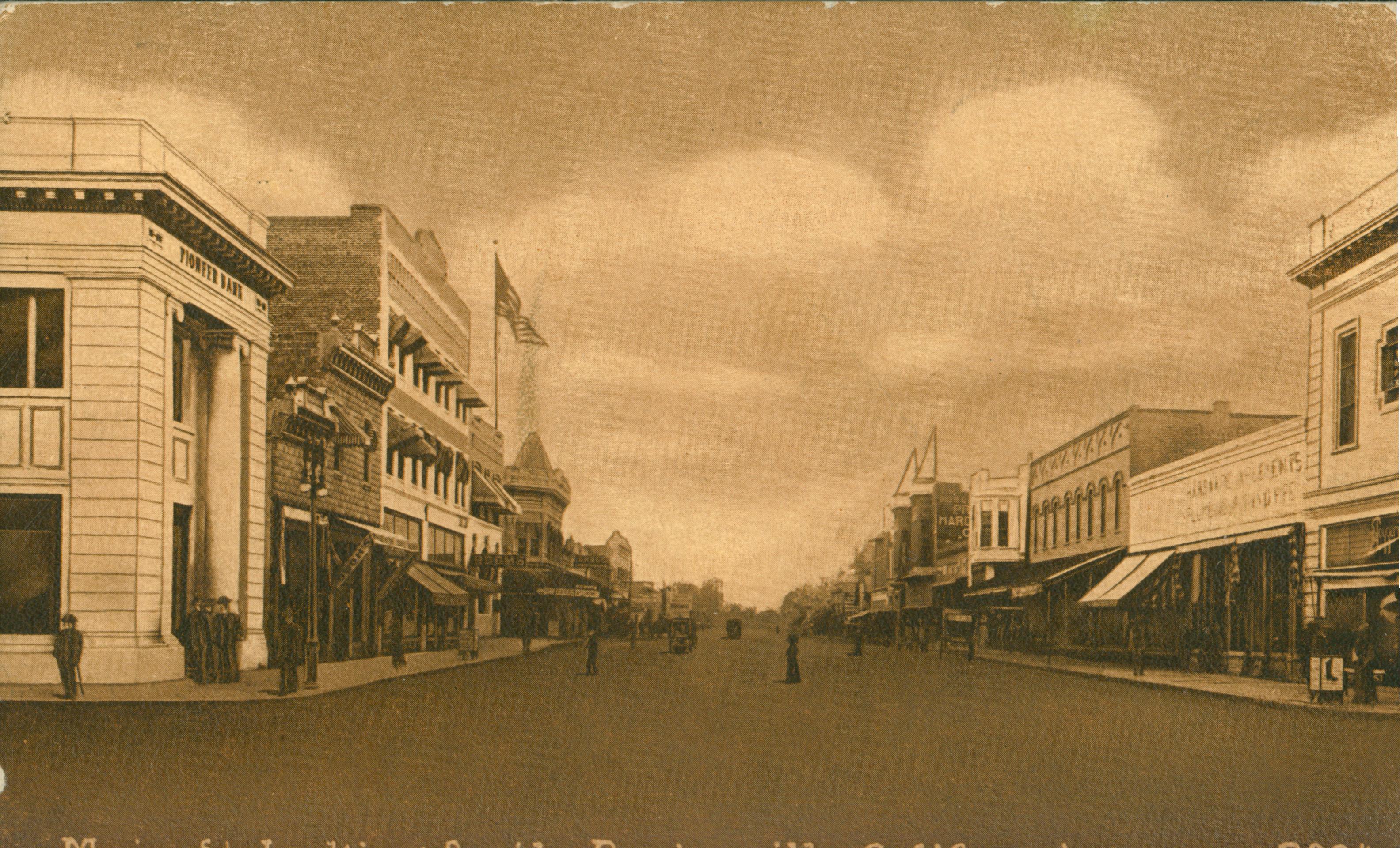 Shows Main Street in Porterville lined with buildings